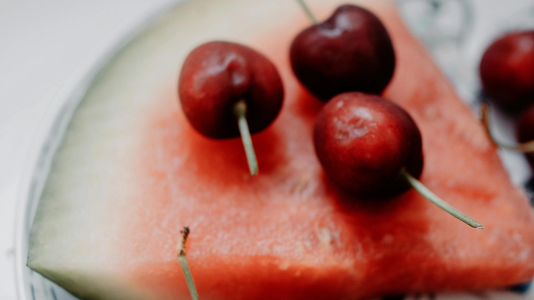 Cherries on a slice of watermelon