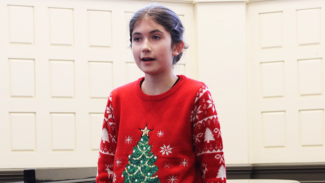 Student singing at the Holiday recital